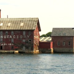 a small boat in a large body of water