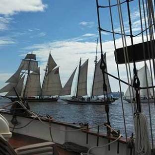 a boat is docked next to a body of water