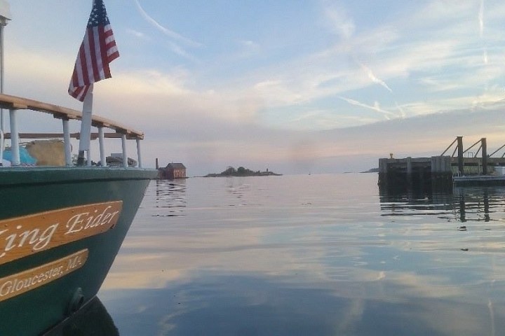 a boat that is sitting on a dock next to a body of water